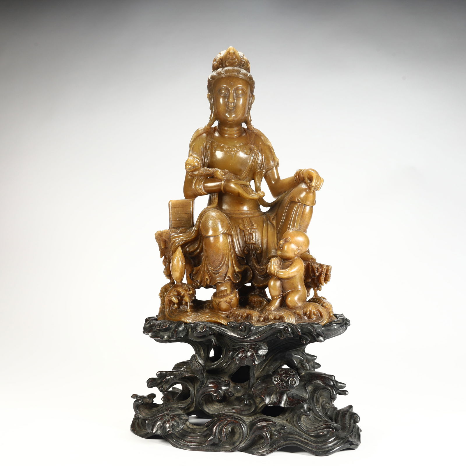 A Qing Dynasty Shoushan stone carving Guanyin sending ornaments (1 of 13)