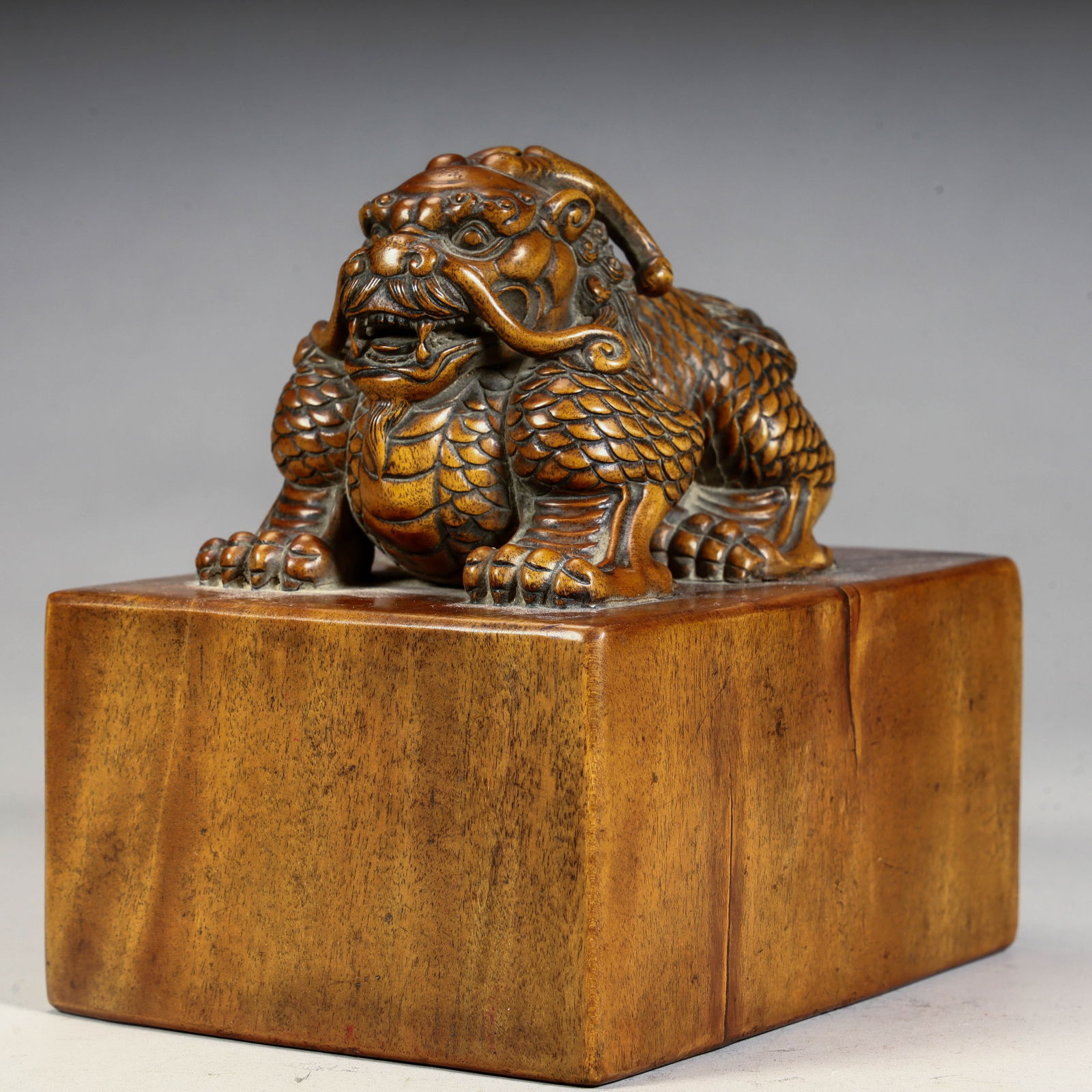 A Qing Dynasty auspicious beast boxwood beast button seal (1 of 9)