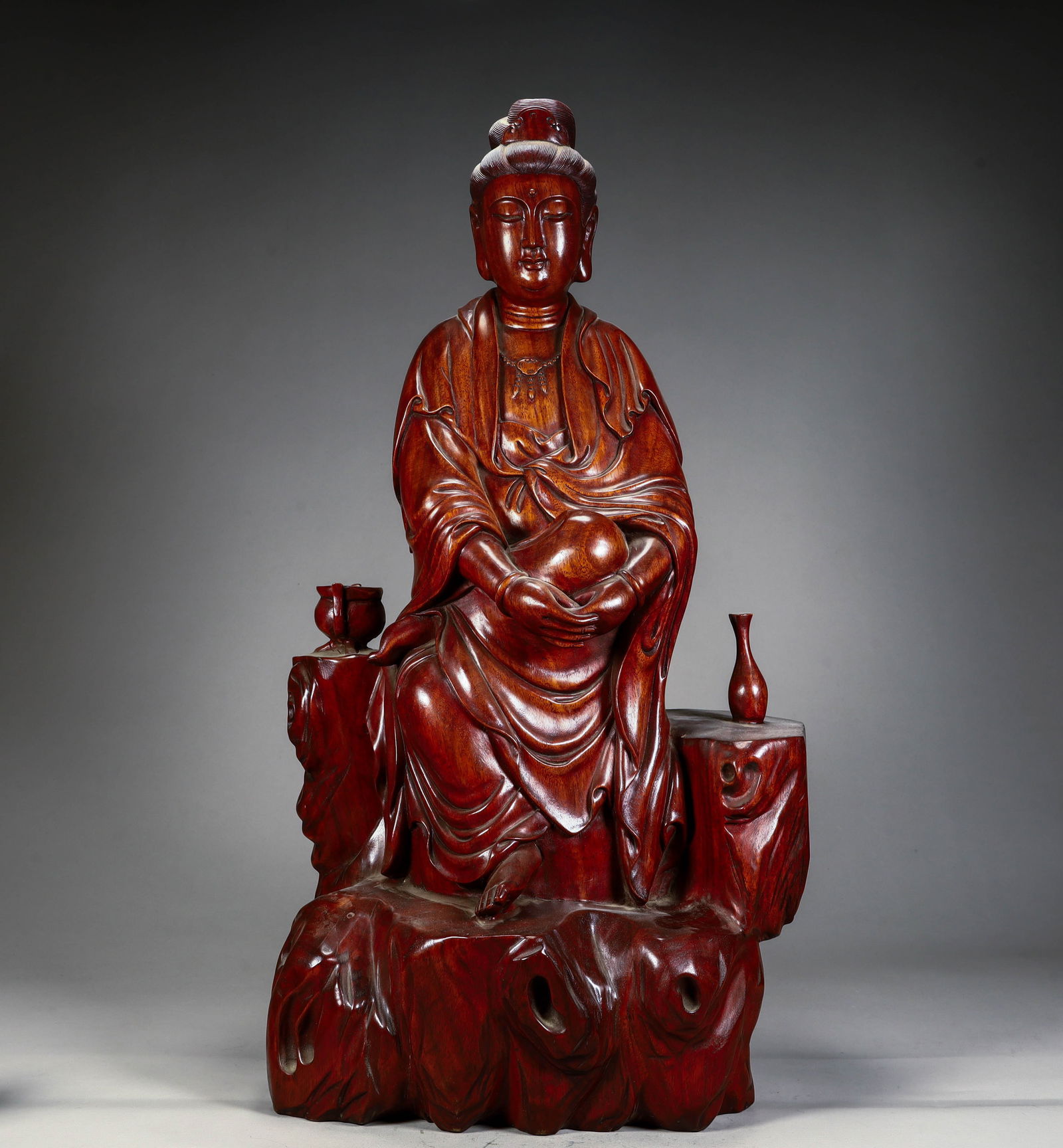 A seated statue of Guanyin carved in mahogany from the Qing Dynasty (1 of 11)