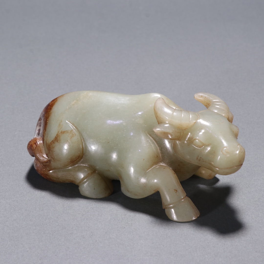 An ancient jade cow ornament from the Han Dynasty (1 of 9)