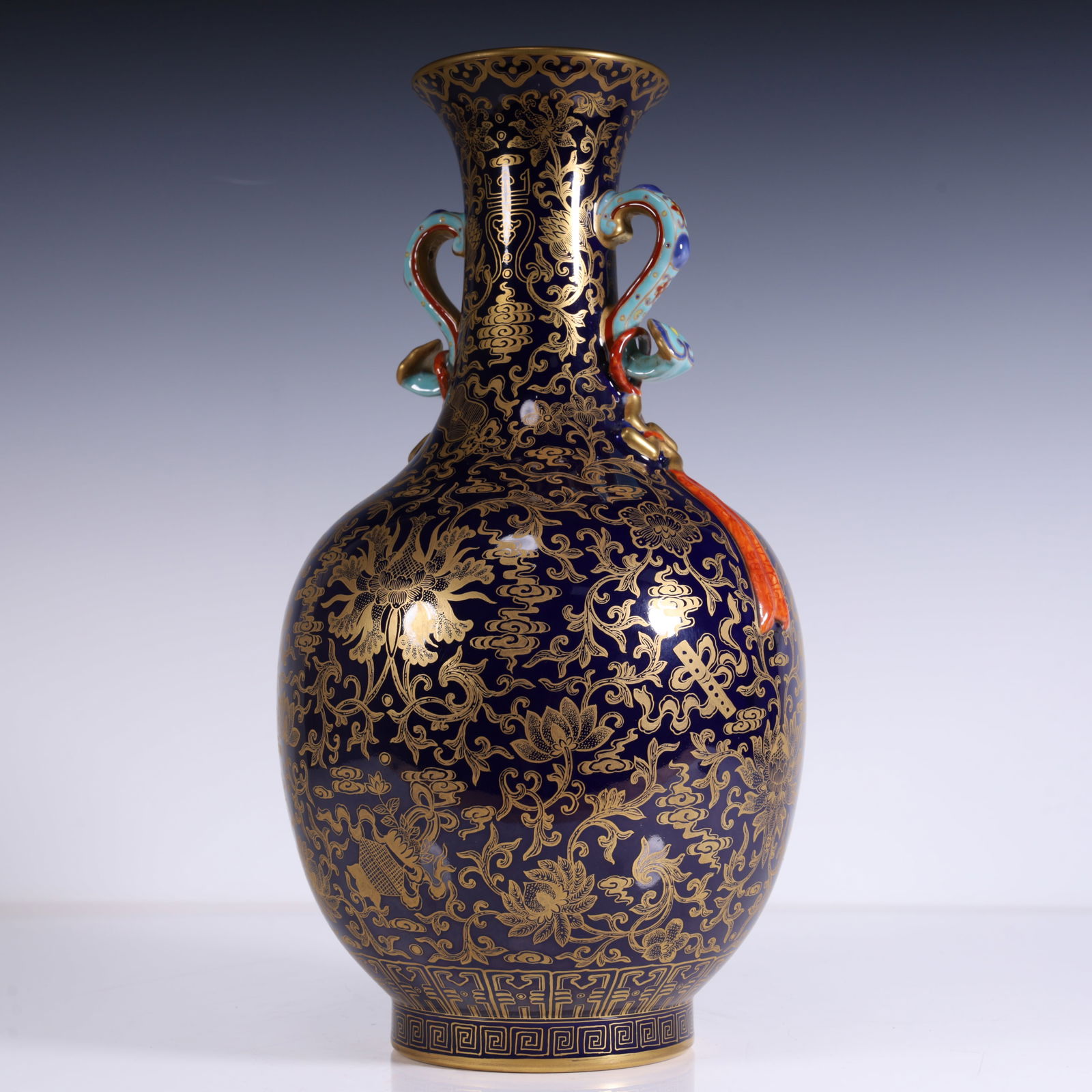 A sapphire blue gold colorful lotus to eight auspicious streamer vase made in the Qianlong period of: Qing Dynasty Qianlong year sapphire blue gold lotus support eight auspicious ruyi streamer bottle SIZE:L:16.5cm W:15cm H:35cm W:1.9kg (The Dimensions Of All Batches Are Manually