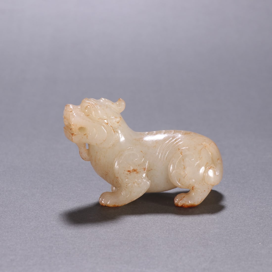 A Qing Dynasty Hetian jade beast ornament: Qing Dynasty Hetian jade auspicious beast ornament Sixe:H:5.1cm W:7.3cm W:112.1g (The Dimensions Of All Batches Are Manually Measured.If You Need More Detailed Information, Please