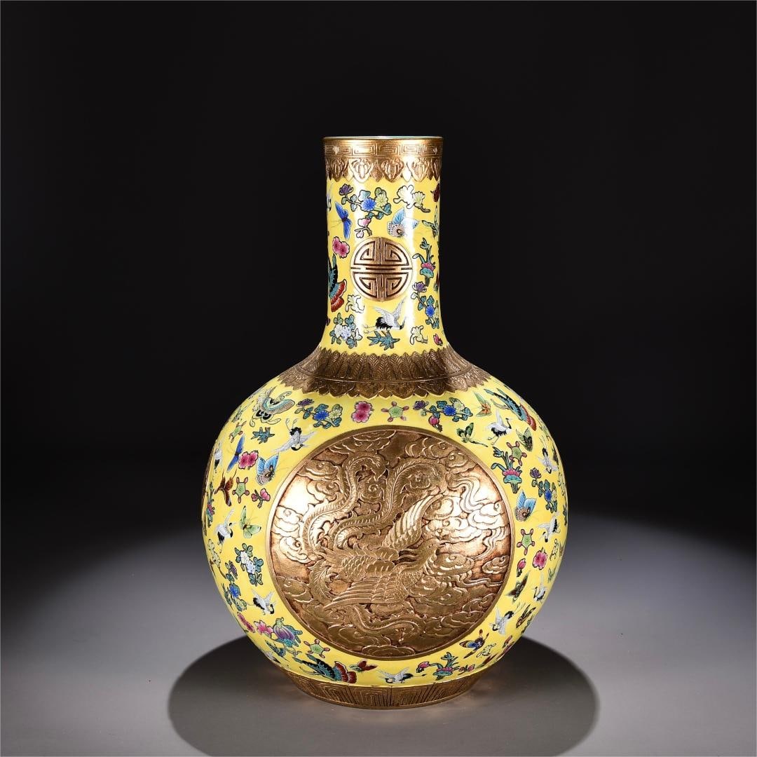 A yellow pastel consecrated carved gilt dragon and phoenix pattern celestial ball vase made in the: Qing Dynasty Qianlong year yellow pastel consecrated carved gilt dragon and phoenix pattern heavenly sphere vase Size:H:50cm W:33cm (The Dimensions Of All Batches Are Manually Measured.If You Need Mor