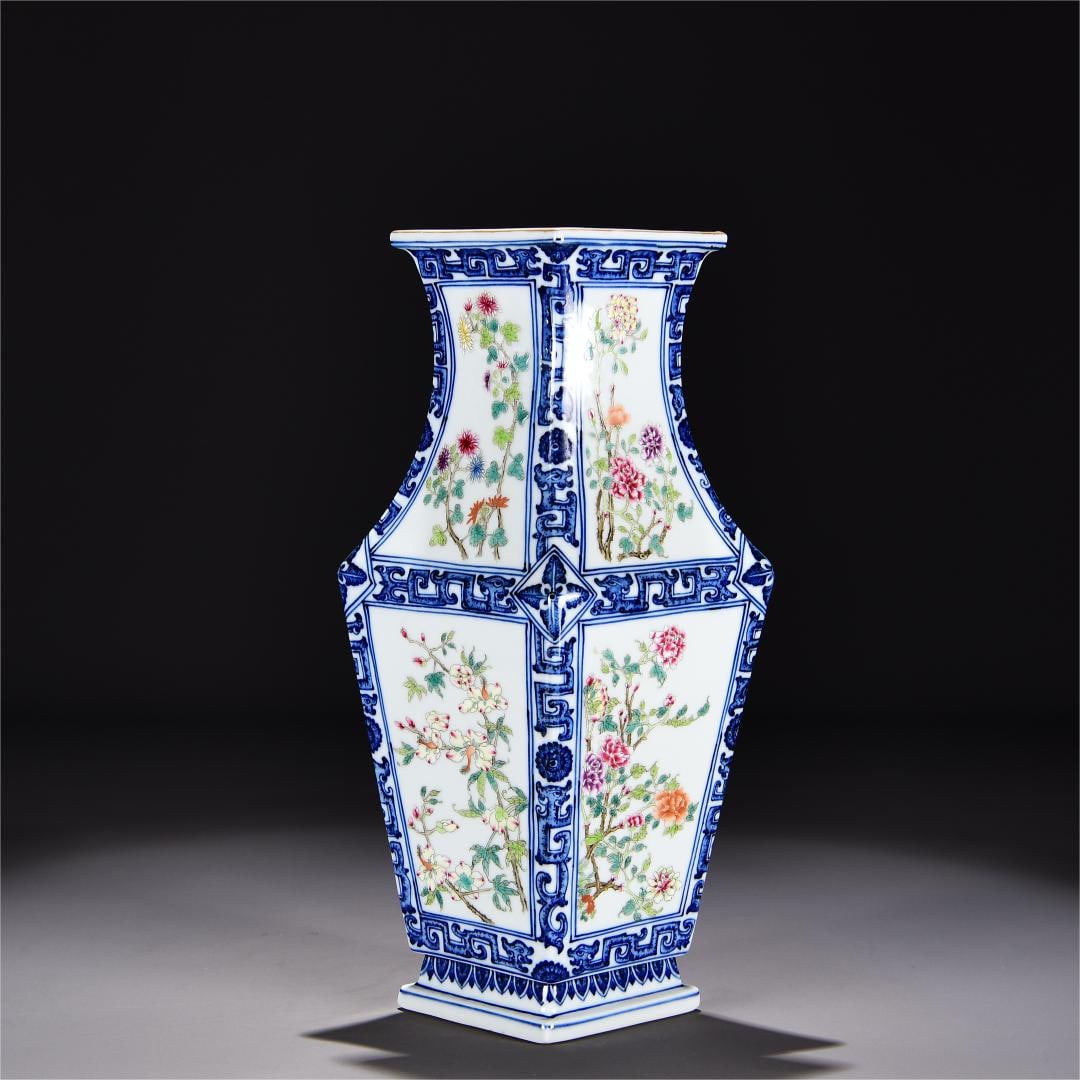 A blue and white convoluted pastel four-season flower and bird vase made in the Qianlong period of: Qing Dynasty Qianlong year blue and white consecrated pastel four-season flower and bird vase Size:H:39cm W:22cm (The Dimensions Of All Batches Are Manually Measured.If You Need