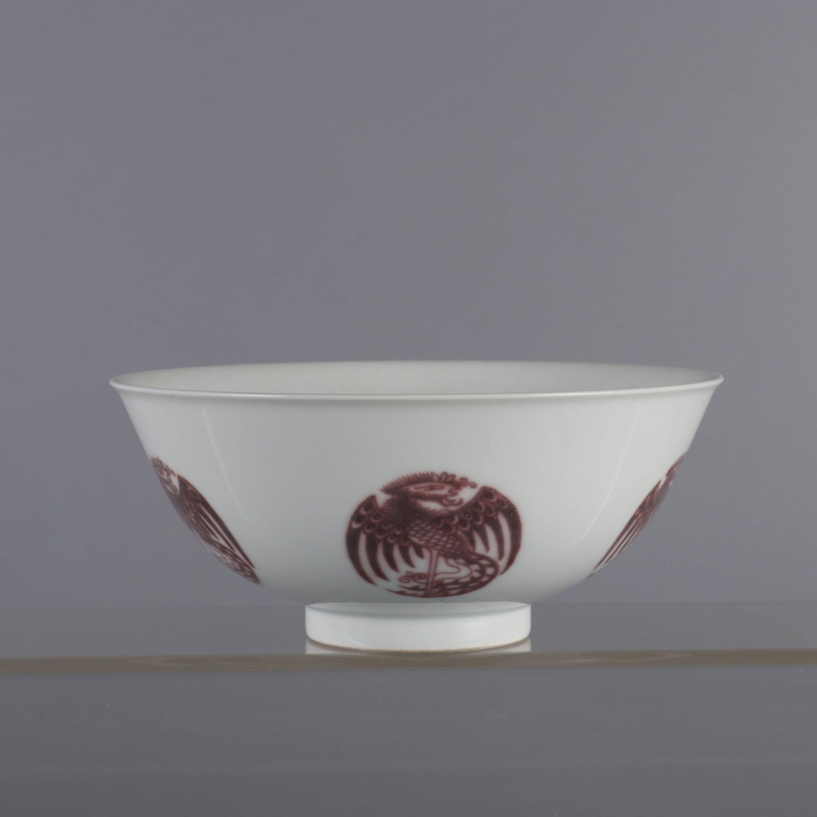 An Exquisite Underglaze-Red Phoenix Pattern Bowl: An Exquisite Underglaze-Red Phoenix Pattern Bowl Qing Dynasty, China Qianlong Six-character Mark Size:6.5cmx15.2cm (The Dimensions Of All Batches Are Manually Measured.If You Need More Detailed