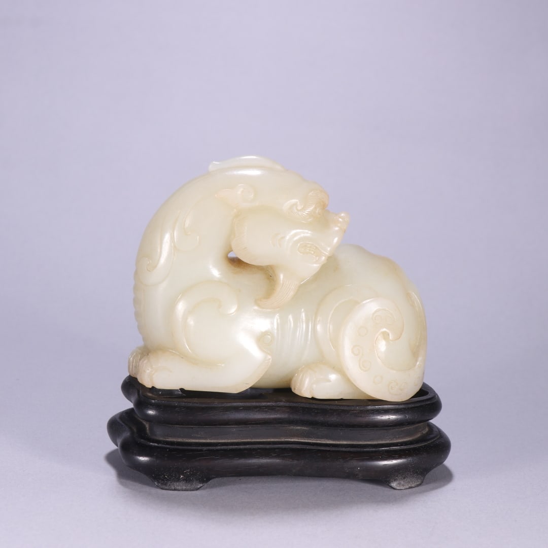 An Exquisite White Jade Auspicious Beast Ornament (1 of 9)