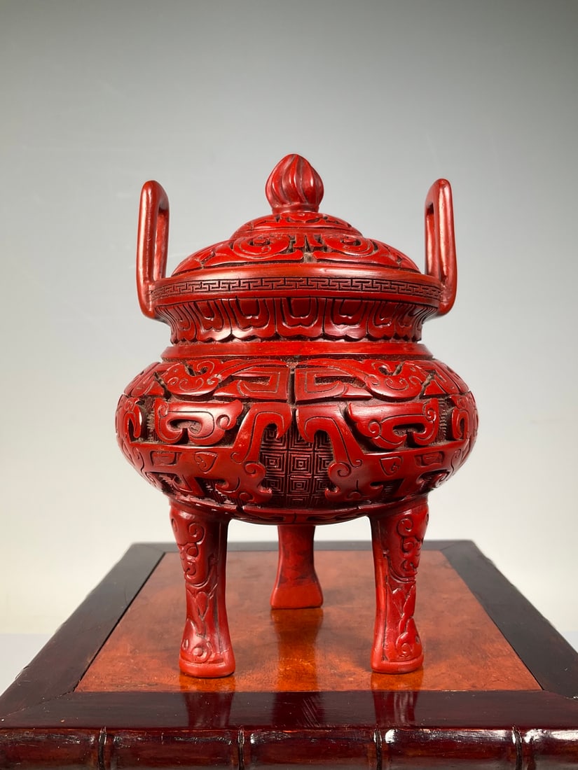 An Exquisite Bronze Carved Red Lacquer Beast-Face Pattern Double-Ears and Tripod Censer: An Exquisite Bronze Carved Red Lacquer Beast-Face Pattern Double-Ears and Tripod Censer Qing Dynasty, China Size:15cmx15cm (The Dimensions Of All Batches Are Manually Measured.If You Need More