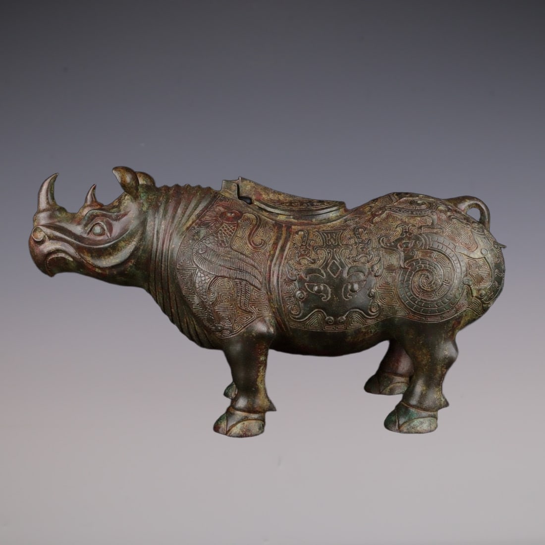 An Exquisite Bronze Beast-Face Pattern Rhinoceros-Shaped Censer: An Exquisite Bronze Beast-Face Pattern Rhinoceros-Shaped Censer W.Zhou , China Size:43cmx14cmx25cm Weight:4400g (The Dimensions Of All Batches Are Manually Measured.If You Need More Detailed