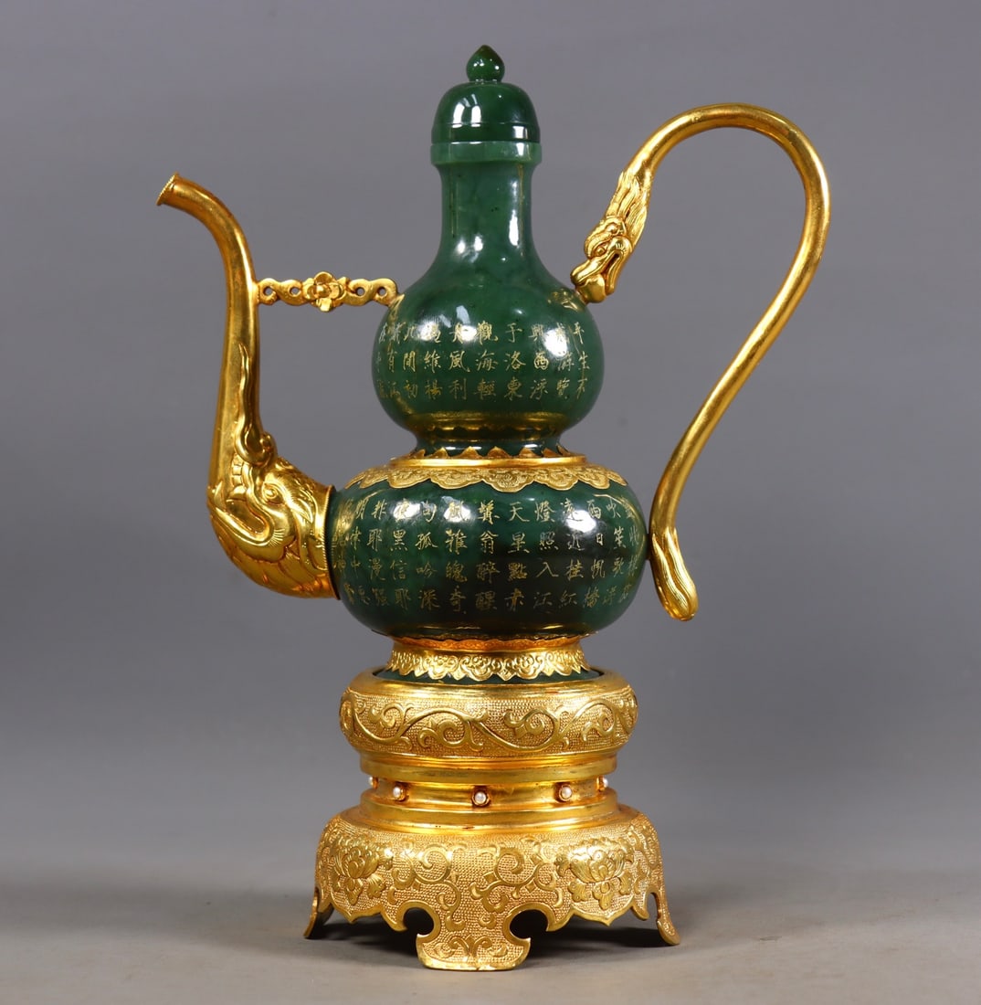 An Exquisite Jasper Cover with Gold Lotus Pattern with poem Ewer: An Exquisite Jasper Cover with Gold Lotus Pattern with poem Ewer Qing Dynasty, China Qianlong Four-character Mark Size:23.5cmx17cmx7cm Weight:1019g (The Dimensions Of All Batches Are Manually