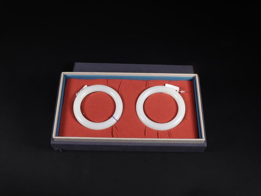 A Pair of Exquisite White Jade Bracelets: A Pair of Exquisite White Jade Bracelets Qing Dynasty, China Size:(inside diameter)5.8cm Diameter Size:8cm Weight:70g Size:(inside diameter)5.8cm Diameter Size:8cm Weight:68g (The Dimensions Of All Ba