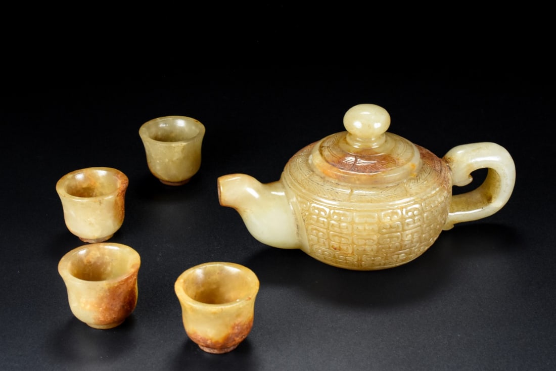 A Set of Fine White Jade Teapot Cup: A Set of Fine White Jade Teapot Cup Han Dynasty, China Size:13.2cmx5.9cmx7.5cm Size:2.5cmx3.1cm Weight:297.5g (The Dimensions Of All Batches Are Manually Measured.If You Need More Detailed