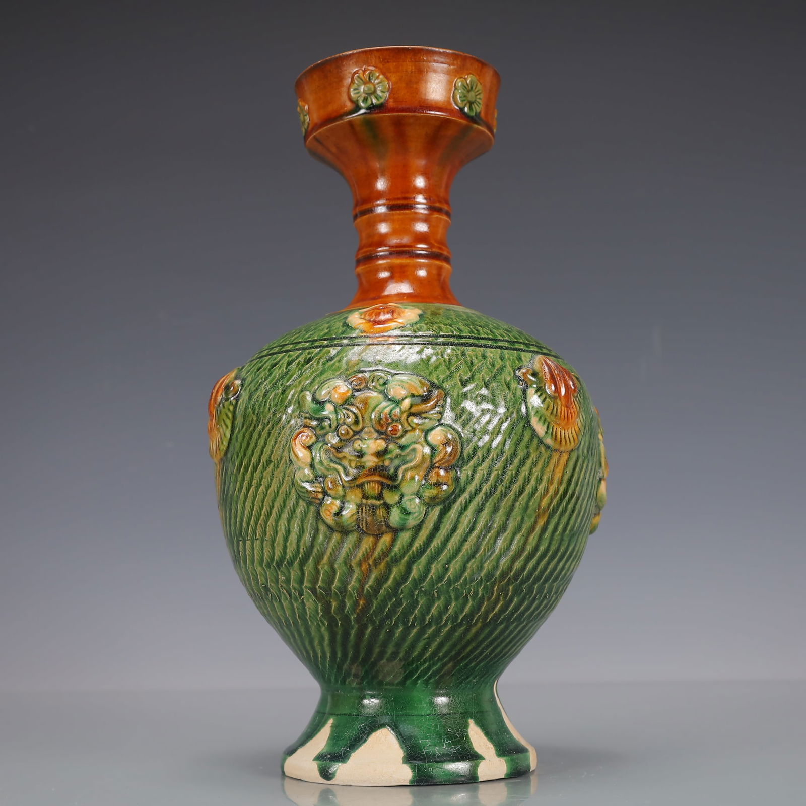 A Exquisite Trio-colored glazed pottery of the Tang Dynasty Beast-Face Pattern Vase (1 of 10)
