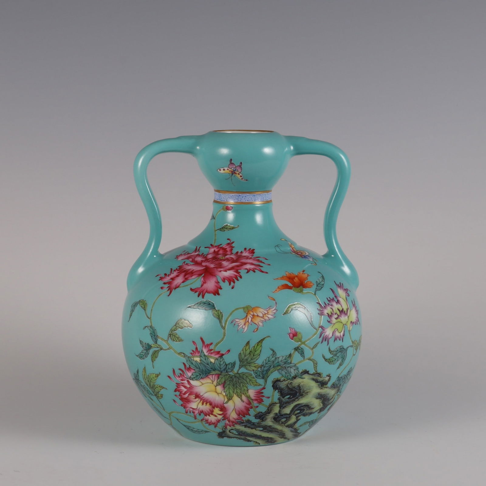 An Exquisite Famille-Rose Green Ground Flower and Butterfly Pattern with poem Double-Ears Vase: An Exquisite Famille-Rose Green Ground Flower and Butterfly Pattern with poem Double-Ears Vase Qing Dynasty, China Qianlong Six-character Mark Size:21.2cmx16.5cm (The Dimensions Of All Batches Are