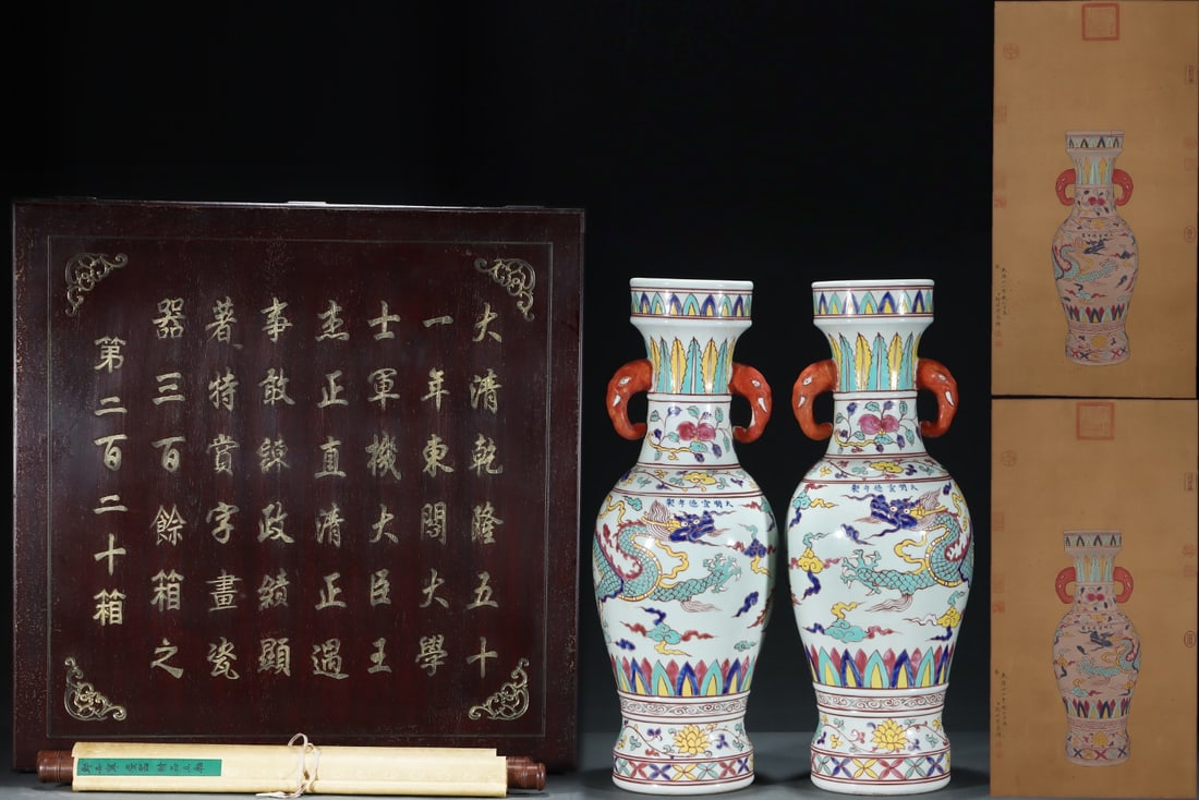 An Exquisite Wucai Dragon Pattern Lotus Pattern Double-Ears Vase: An Exquisite Wucai Dragon Pattern Lotus Pattern Double-Ears Vase Ming Dynasty, China Xuande Six-character Mark Without frame Size:81cmx42cm Size:60cmx22.5cm (The Dimensions Of All Batches Are