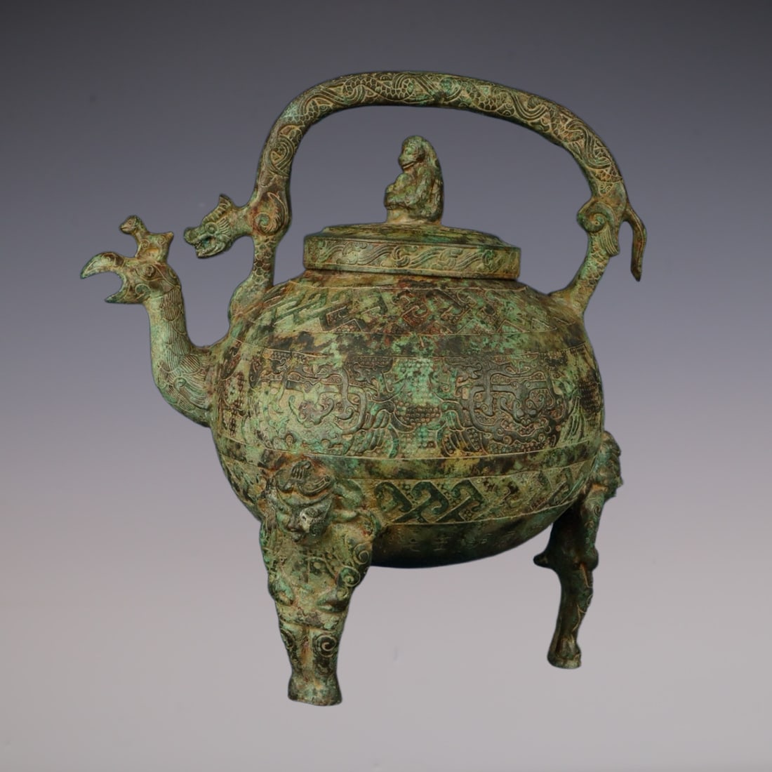 An Exquisite Bronze Beast-Face Pattern With Inscription Tripod Ewer: An Exquisite Bronze Beast-Face Pattern With Inscription Tripod Ewer Han Dynasty, China Size:24cmx17cmx27cm Weight:2500g (The Dimensions Of All Batches Are Manually Measured.If You Need More