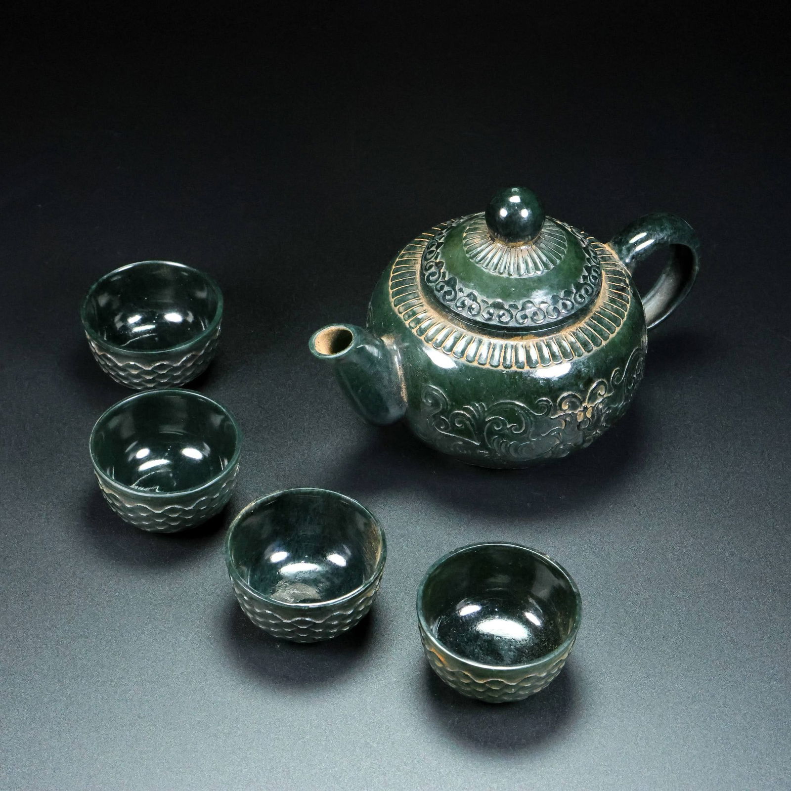 A Set of Fine Jasper Lotus Pattern Teapot Cup: A Set of Fine Jasper Lotus Pattern Teapot Cup Qing Dynasty, China Size:17cmx11cmx11cm Size:3cmx5cm Weight:299g (The Dimensions Of All Batches Are Manually Measured.If You Need More Detailed