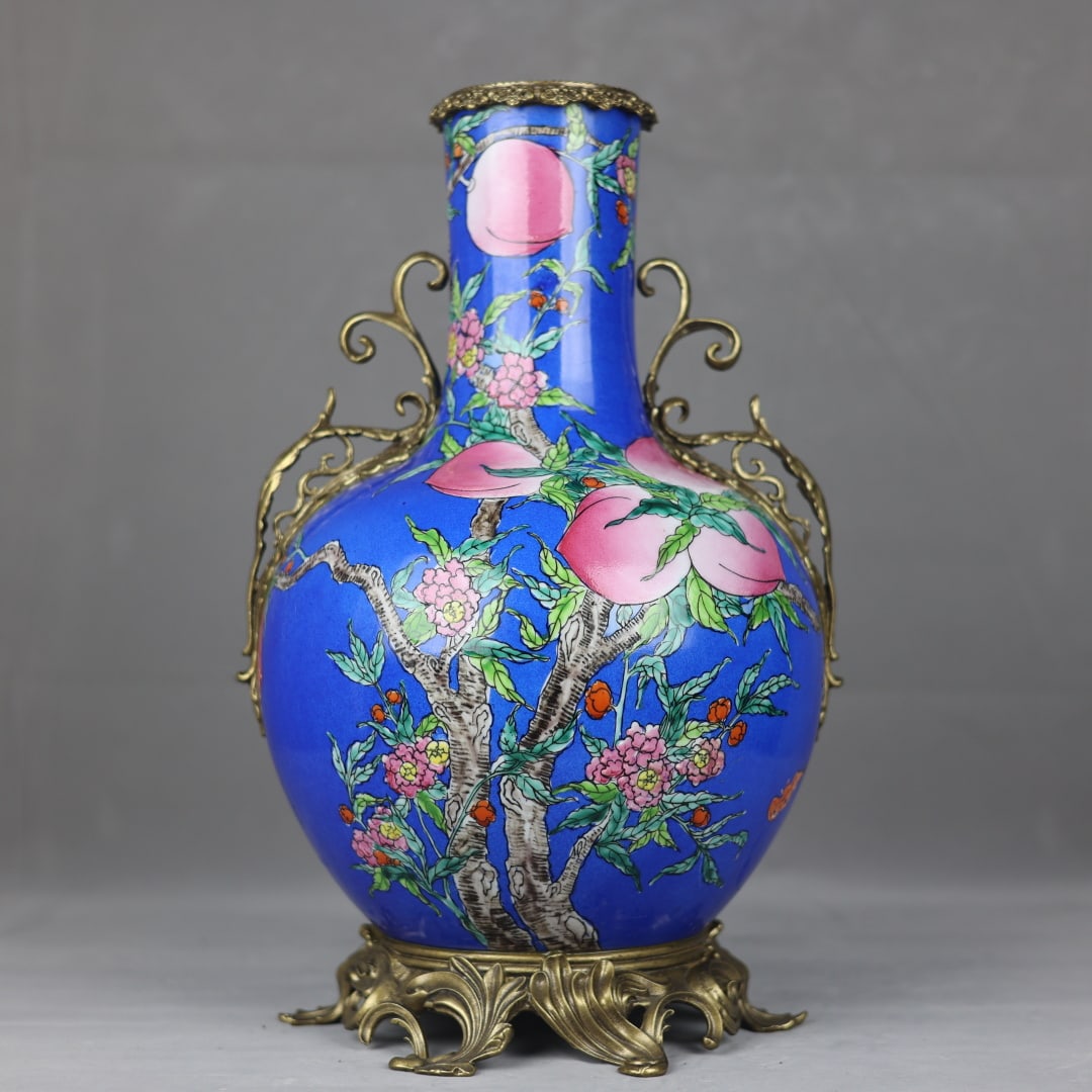 An Exquisite Famille-Rose Inlaid Bronze Bats and Peach Pattern Double-Ears Vase: An Exquisite Famille-Rose Inlaid Bronze Bats and Peach Pattern Double-Ears Vase Qing Dynasty, China Qianlong Four-character Mark Size:45cmx27cm (The Dimensions Of All Batches Are Manually