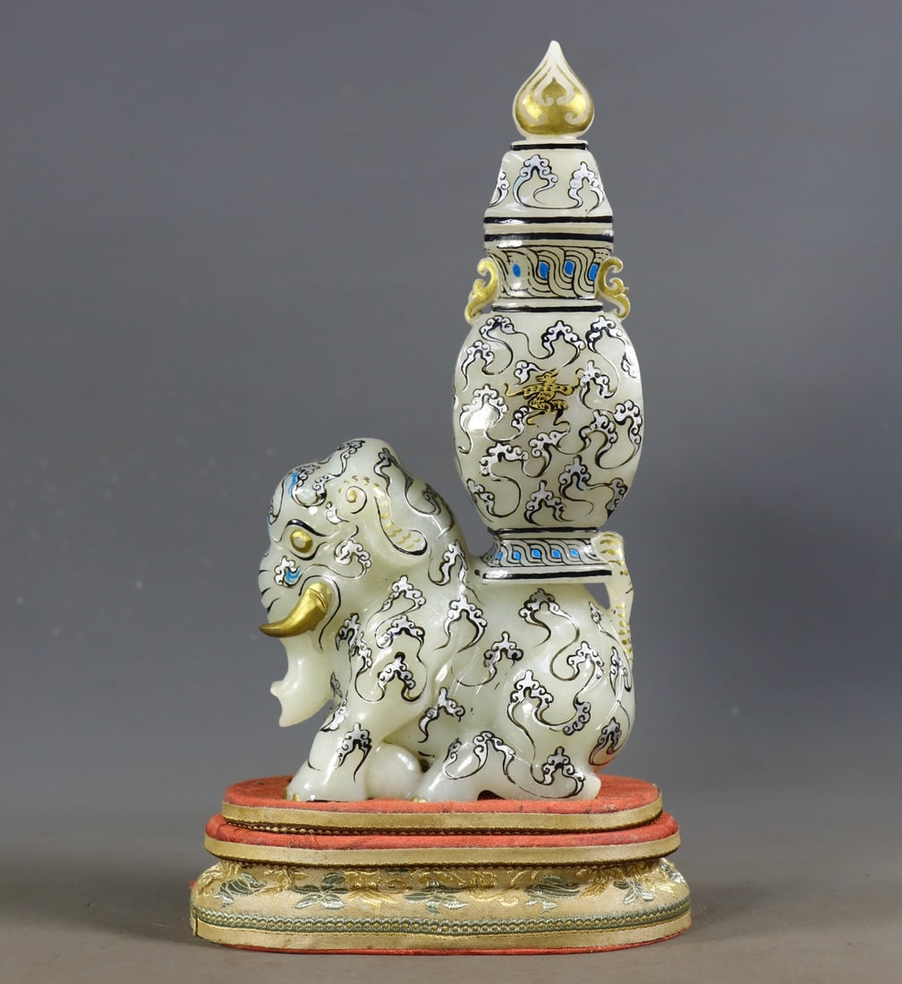 An Exquisite White Jade Inlaid Gold and Silver Painted Color Elephant-Shaped Vase: An Exquisite White Jade Inlaid Gold and Silver Painted Color Elephant-Shaped Vase Qing Dynasty, China Size:23cmx10.5cmx5.5cm Weight:1428g (The Dimensions Of All Batches Are Manually Measured.If You