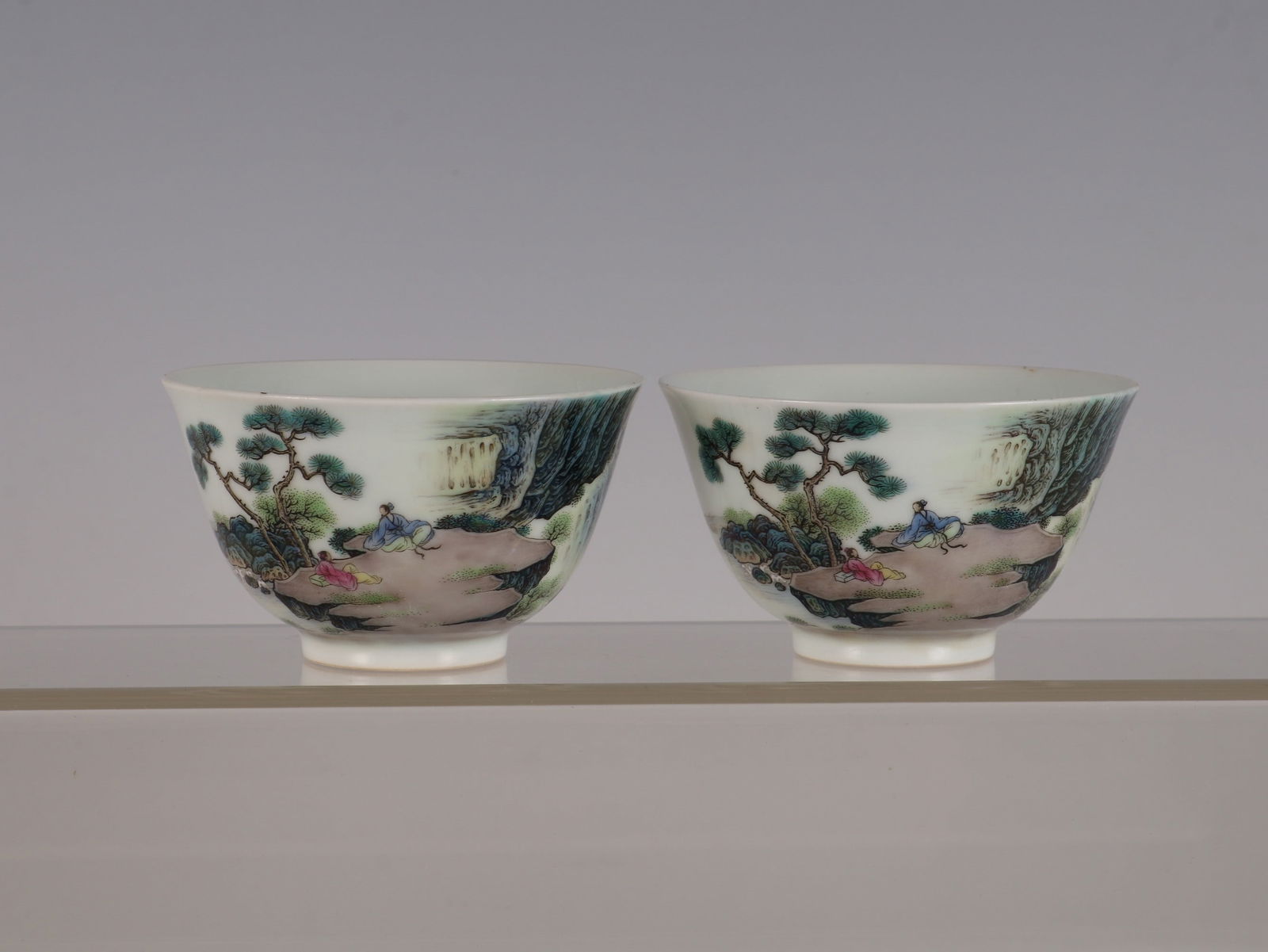 A Pair of Exquisite Famille-Rose Landscape and Figure Pattern with poem Cup: A Pair of Exquisite Famille-Rose Landscape and Figure Pattern with poem Cup Qing Dynasty, China Yongzheng Six-character Mark Size:5.5cmx9cm (The Dimensions Of All Batches Are Manually Measured.If