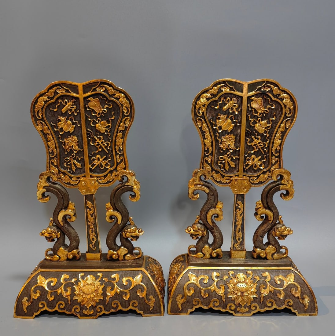 A Pair of Exquisite Gilt Bronze Eight Treasures Pattern Lotus Pattern Screen: A Pair of Exquisite Gilt Bronze Eight Treasures Pattern Lotus Pattern Screen Qing Dynasty, China Qianlong Four-character Mark Size:28cmx18.5cmx9.5cm Weight:2806g (The Dimensions Of All Batches Are