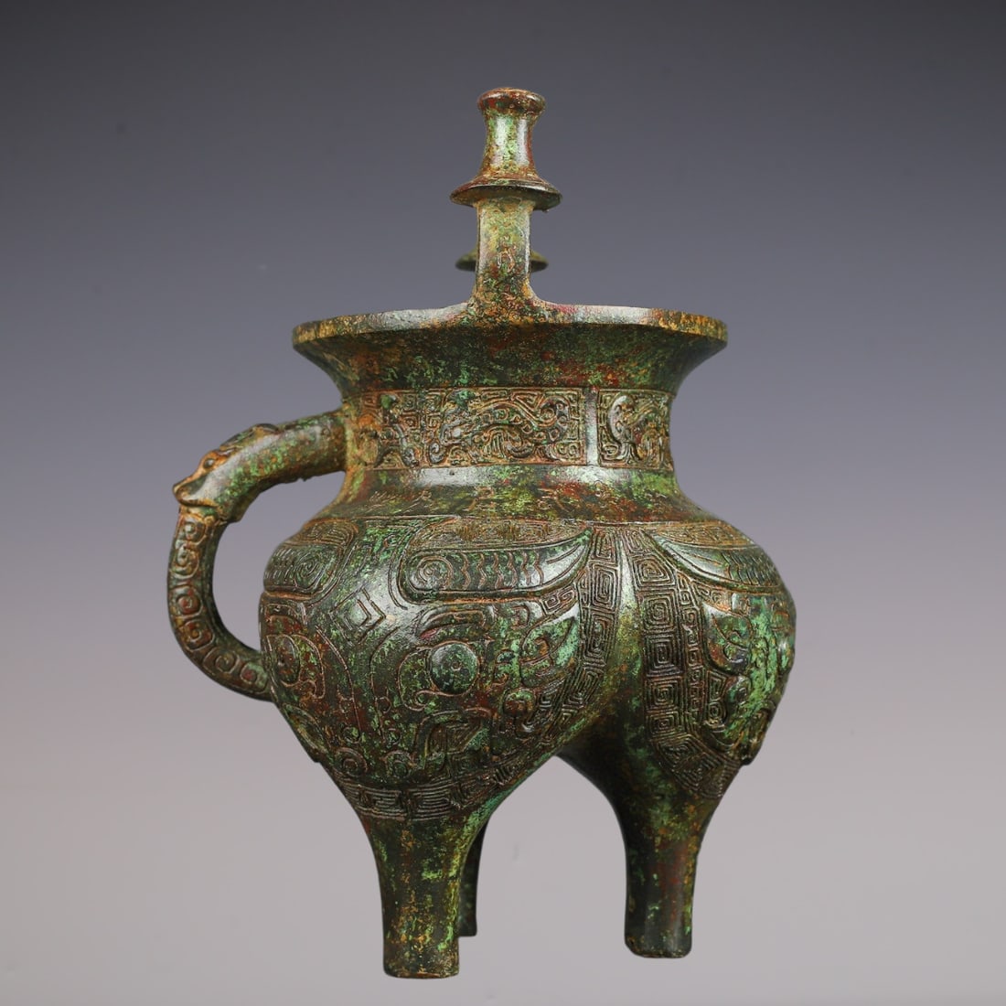 An Exquisite Bronze Beast-Face Pattern Ewer: An Exquisite Bronze Beast-Face Pattern Ewer W.Zhou , China Size:20cmx25cm Weight:2050g (The Dimensions Of All Batches Are Manually Measured.If You Need More Detailed Information, Please Contact Our