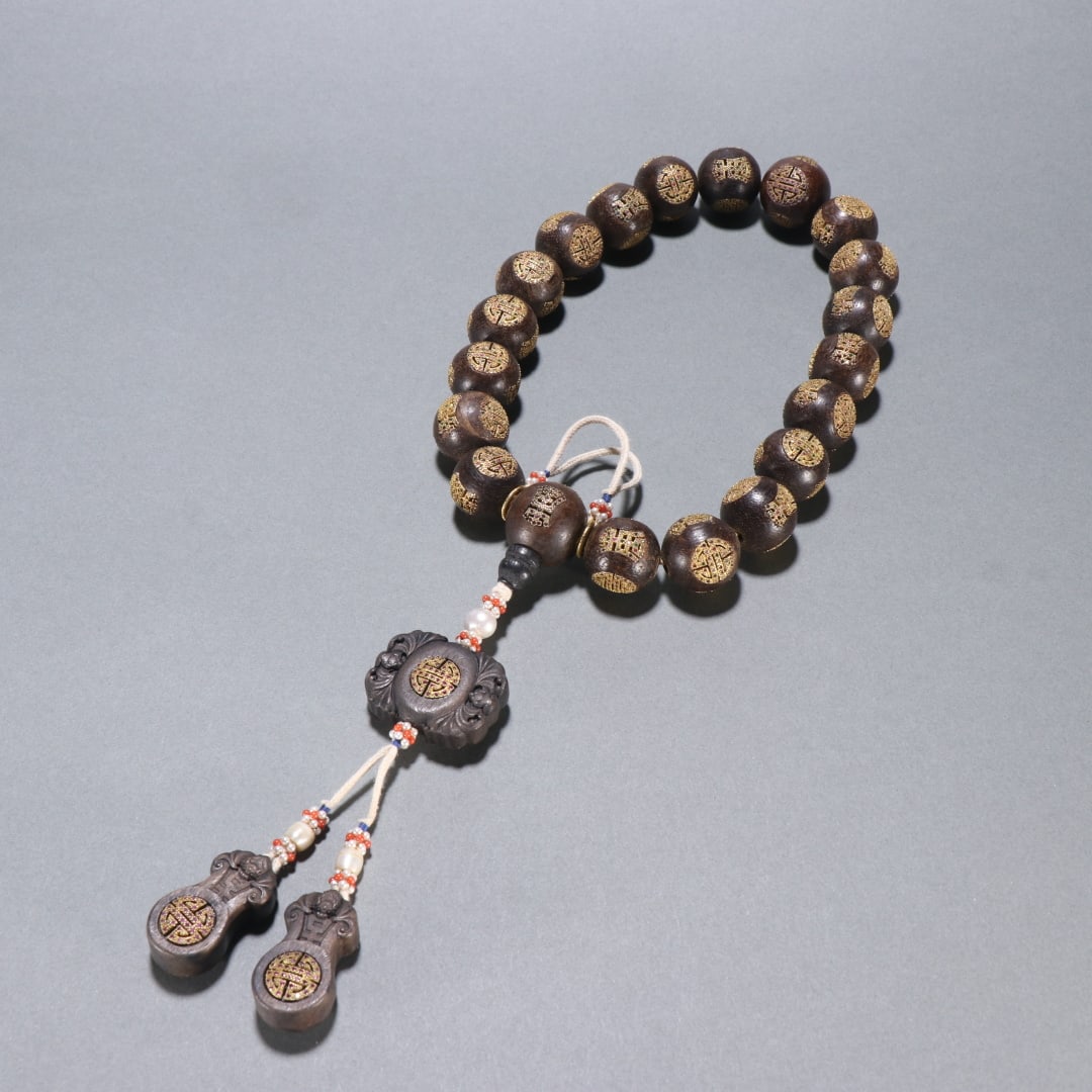 An Exquisite Eaglewood Inlaid Gilt Silver Bats and Peach Pattern Bracelets: An Exquisite Eaglewood Inlaid Gilt Silver Bats and Peach Pattern Bracelets Qing Dynasty, China Size:2cm Weight:154.5g (The Dimensions Of All Batches Are Manually Measured.If You Need More Detailed