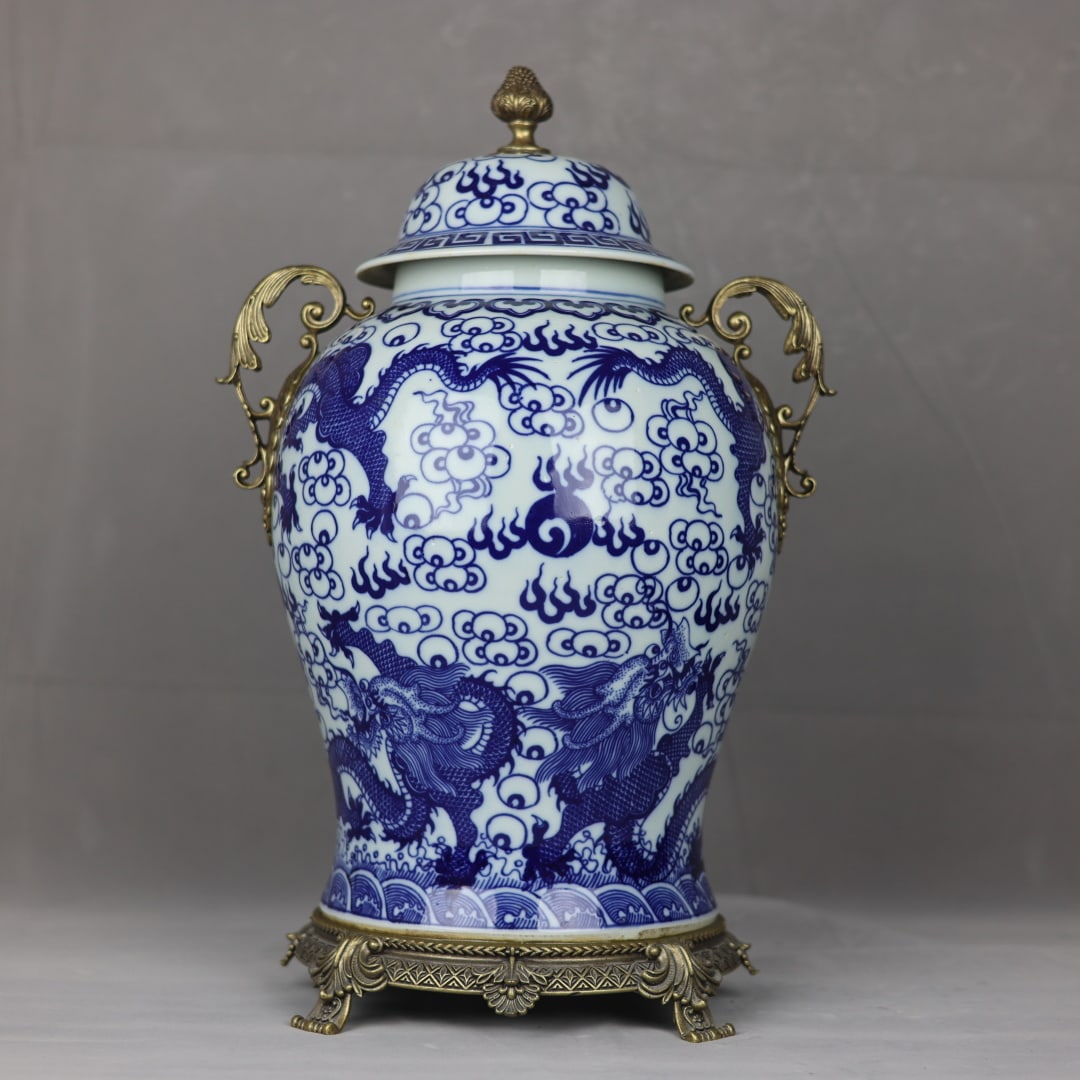 An Exquisite Blue and White Inlaid Bronze Seawater Pattern Dragon Pattern Double-Ears Jar: An Exquisite Blue and White Inlaid Bronze Seawater Pattern Dragon Pattern Double-Ears Jar Qing Dynasty, China Kangxi Six-character Mark Size:50cmx30cm (The Dimensions Of All Batches Are Manually
