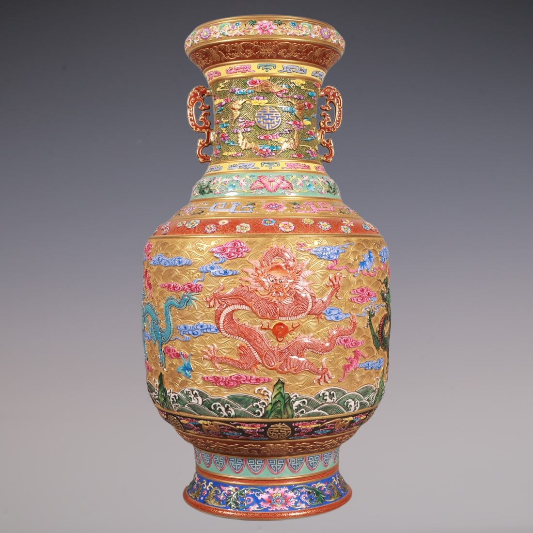 An Exquisite Enamel Bats and Peach Pattern Lotus Pattern Dragon Pattern Seawater Pattern Double-Ears: An Exquisite Enamel Bats and Peach Pattern Lotus Pattern Dragon Pattern Seawater Pattern Double-Ears Vase Qing Dynasty, China Qianlong Six-character Mark Size:40cmx21cm (The Dimensions Of All