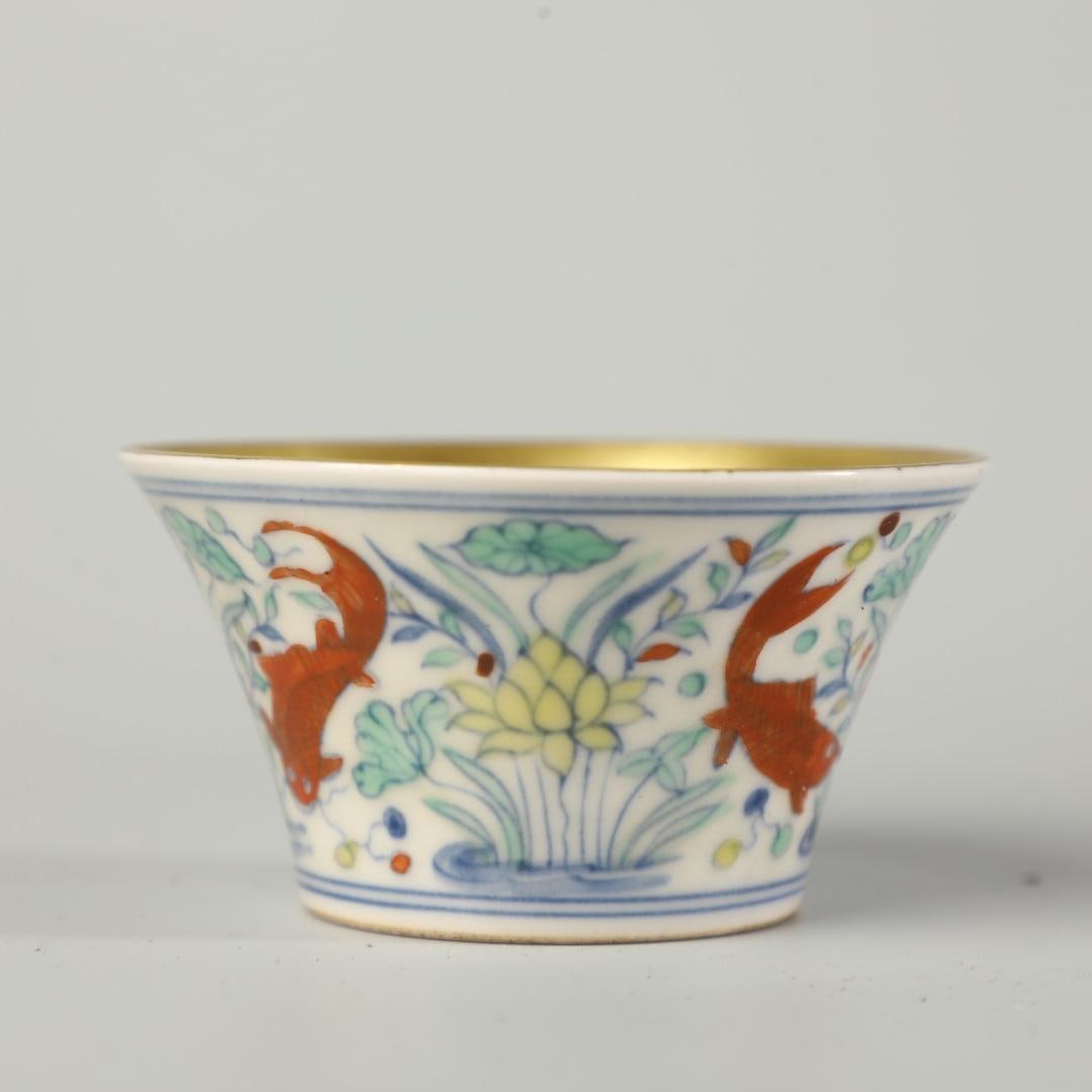 A Doucai cup made in the Chenghua year of the Ming Dynasty: The Doucai cup of the Ming Dynasty Chenghua year Size:H:4cm D:8cm (The Dimensions Of All Batches Are Manually Measured.If You Need More Detailed Information, Please Contact Our