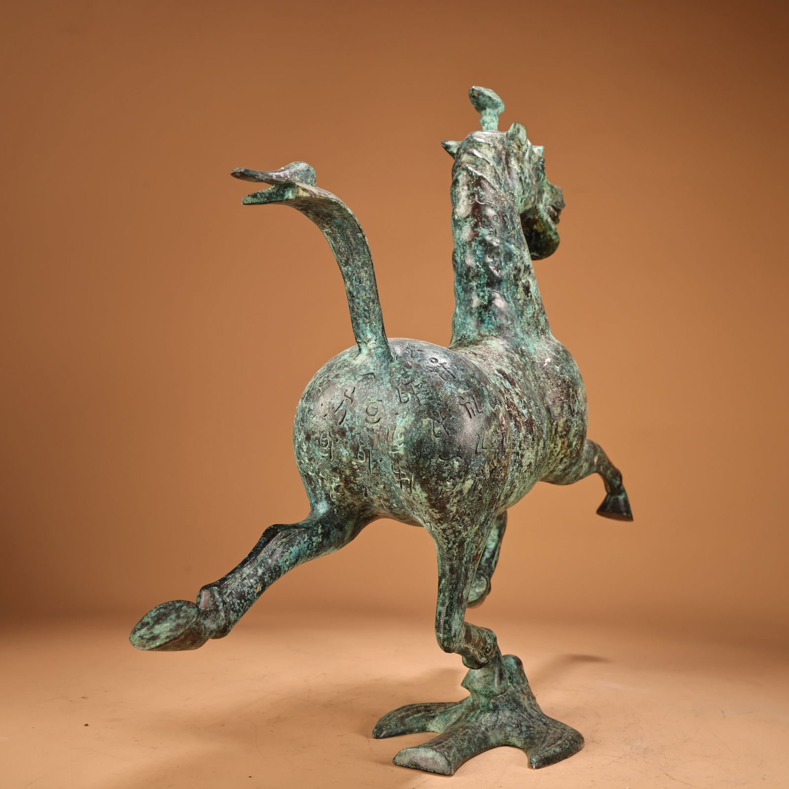 A beautiful bronze horse stepping on a flying swallow - 10