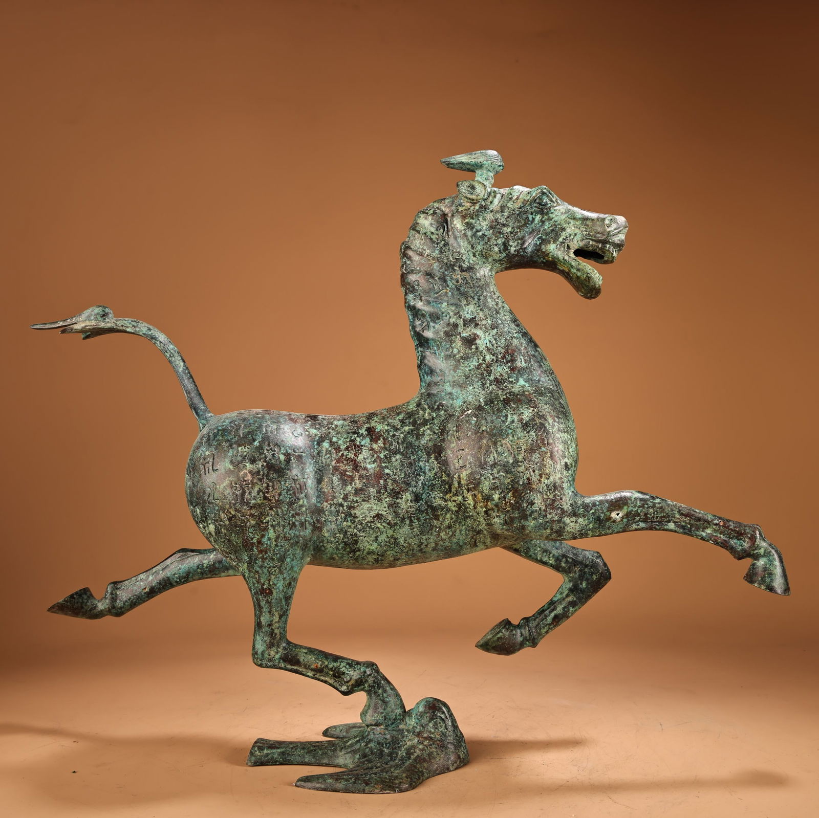 A beautiful bronze horse stepping on a flying swallow - 11