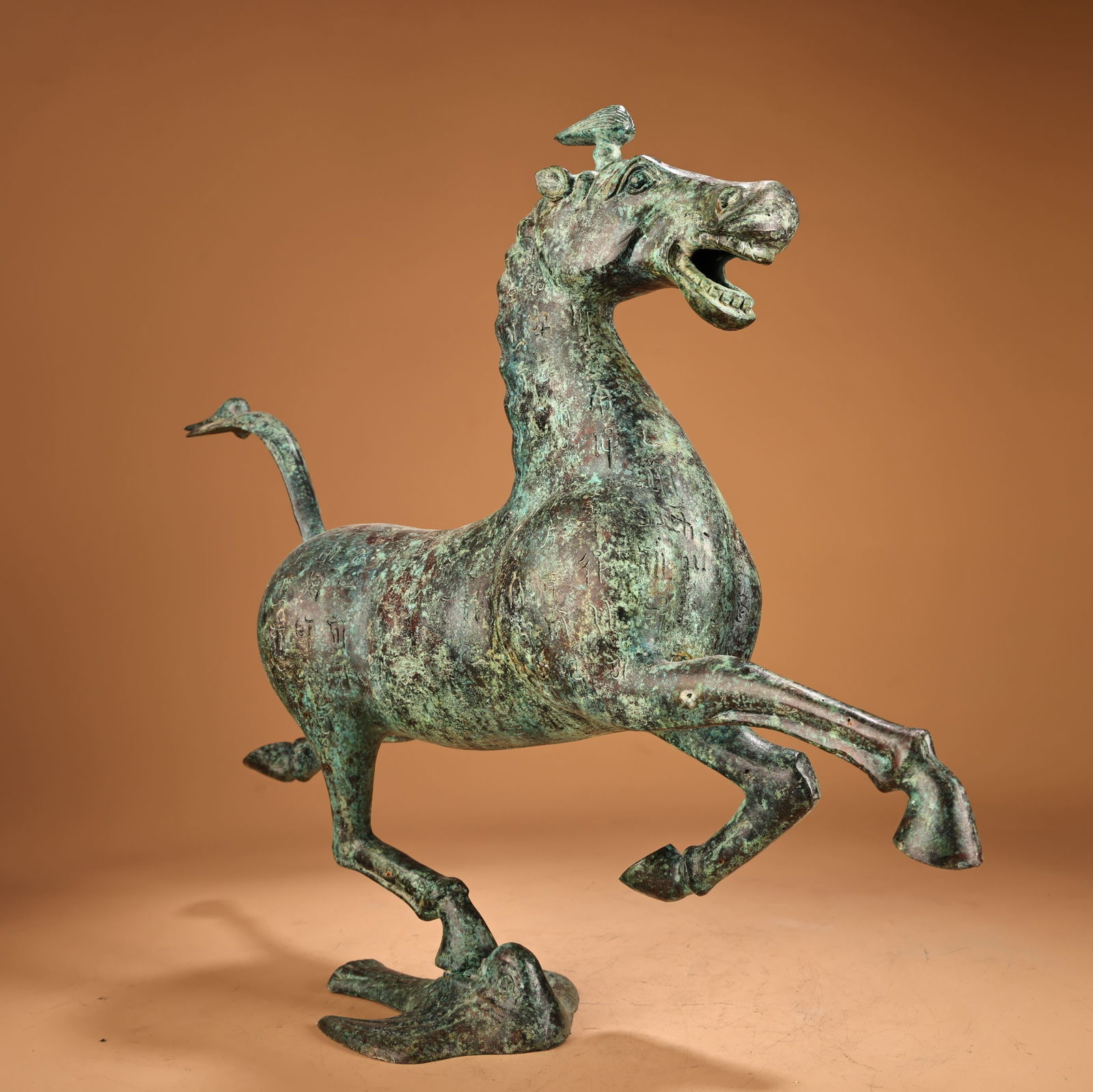 A beautiful bronze horse stepping on a flying swallow - 13