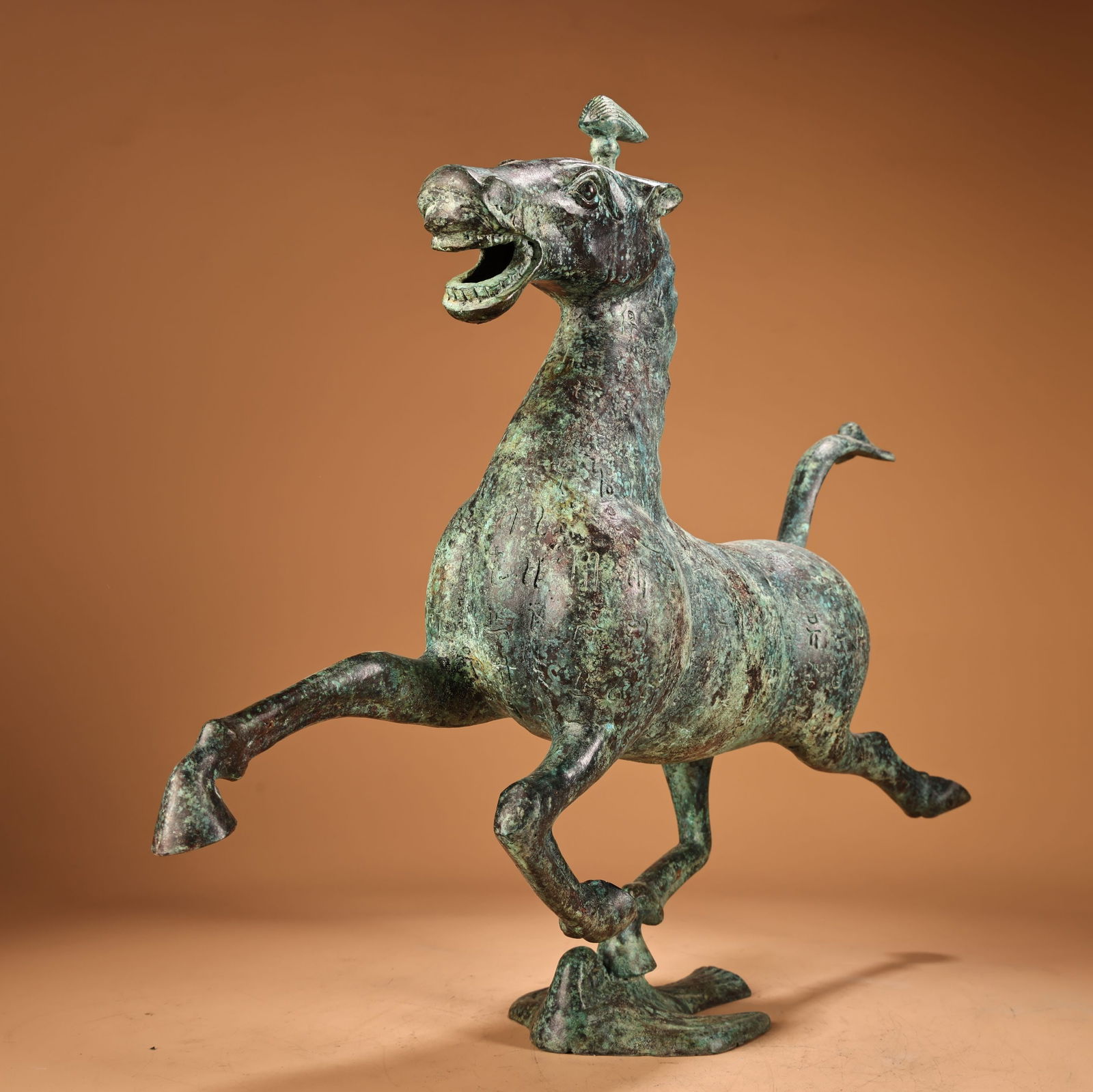 A beautiful bronze horse stepping on a flying swallow - 2
