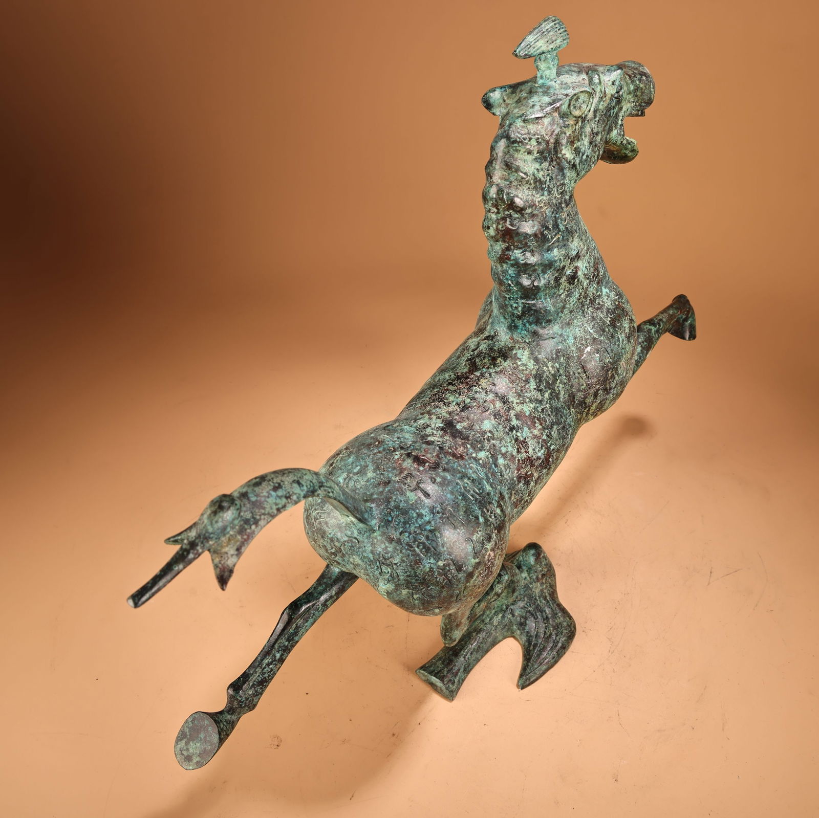 A beautiful bronze horse stepping on a flying swallow - 8