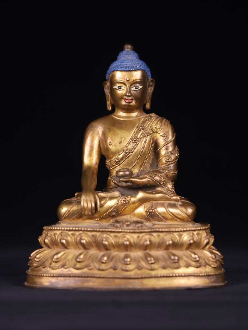 A seated statue of the Medicine Buddha in copper gilt from the Ming Dynasty (1 of 9)