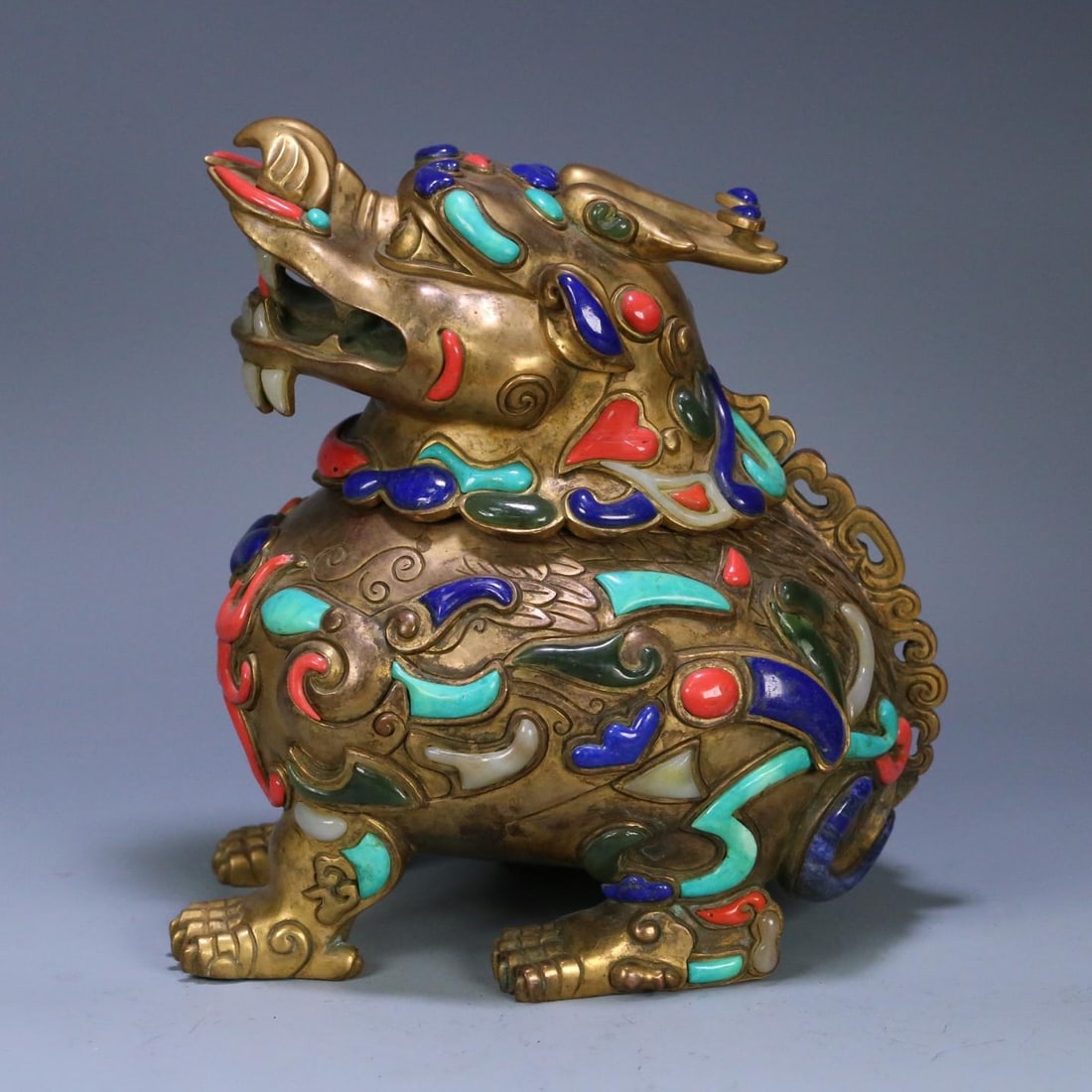 A Qing Dynasty court copper gilt inlaid with a hundred treasures lion aromatherapy stove (1 of 9)