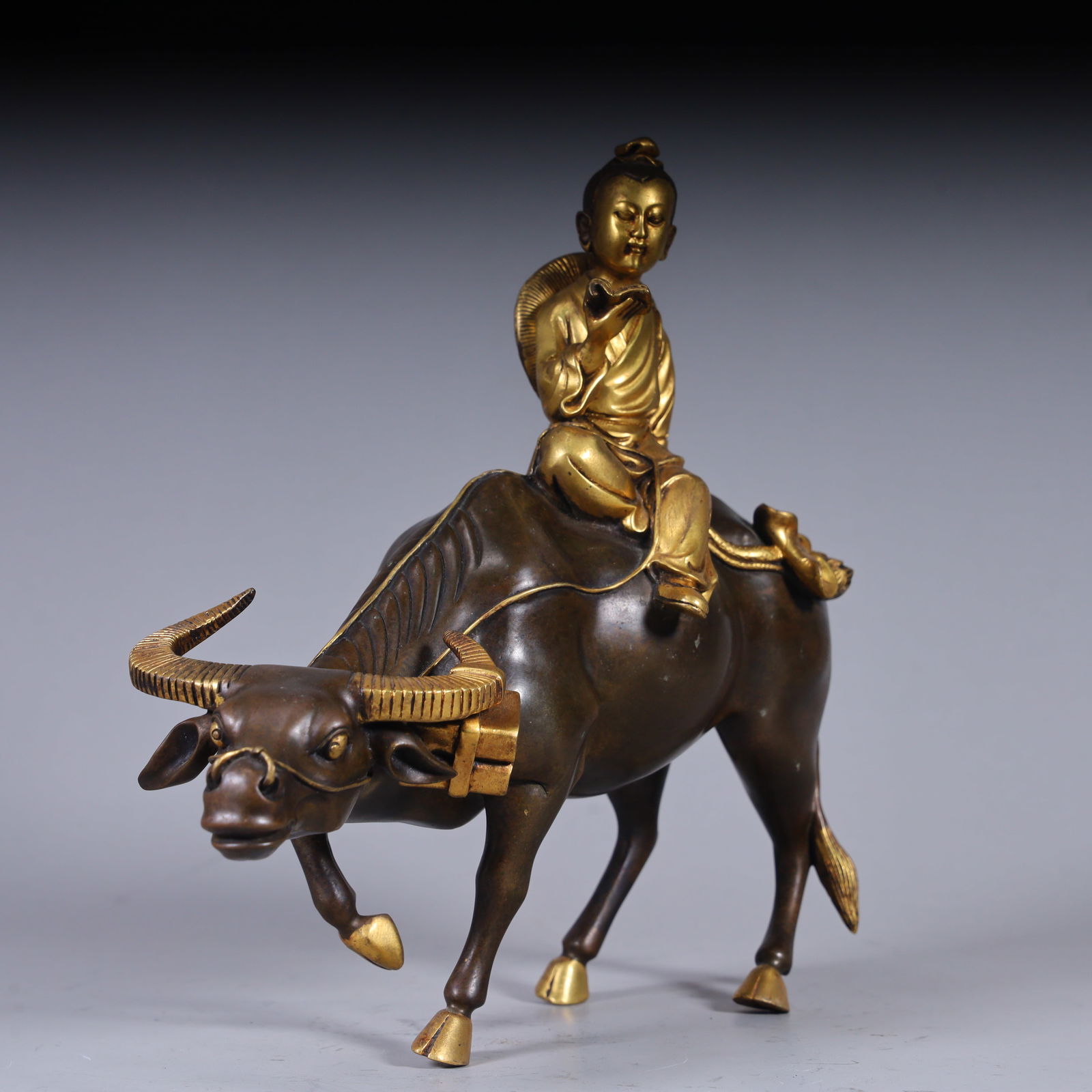 A copper gilt boy cattle herding ornament from the Qing Dynasty: Qing Dynasty copper gilt boy cattle ornament Size:H:22cm L: 25cm W:8cm W:1.9kg (The Dimensions Of All Batches Are Manually Measured.If You Need More Detailed Information, Please