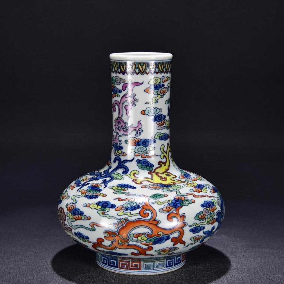 A water chestnut bottle made in the Yongzheng year of the Qing Dynasty: Qing Dynasty Yongzheng year Doucai auspicious cloud dragon pattern water chestnut bottle Size:H:27cm W:20cm (The Dimensions Of All Batches Are Manually Measured.If You Need More