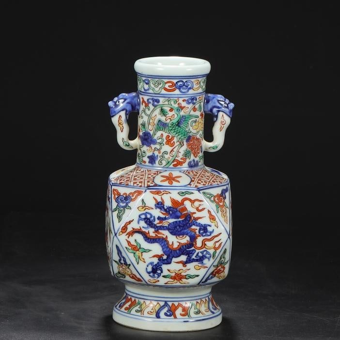 A blue and white colorful dragon and phoenix pattern elephant ear vase made in the Jiajing period of: The blue and white colorful dragon and phoenix pattern elephant ear vase made in the Jiajing year of the Ming Dynasty Size:H:22.8cmCalibre6cmBelly diameter10cm (The Dimensions Of All Batches Are Manua