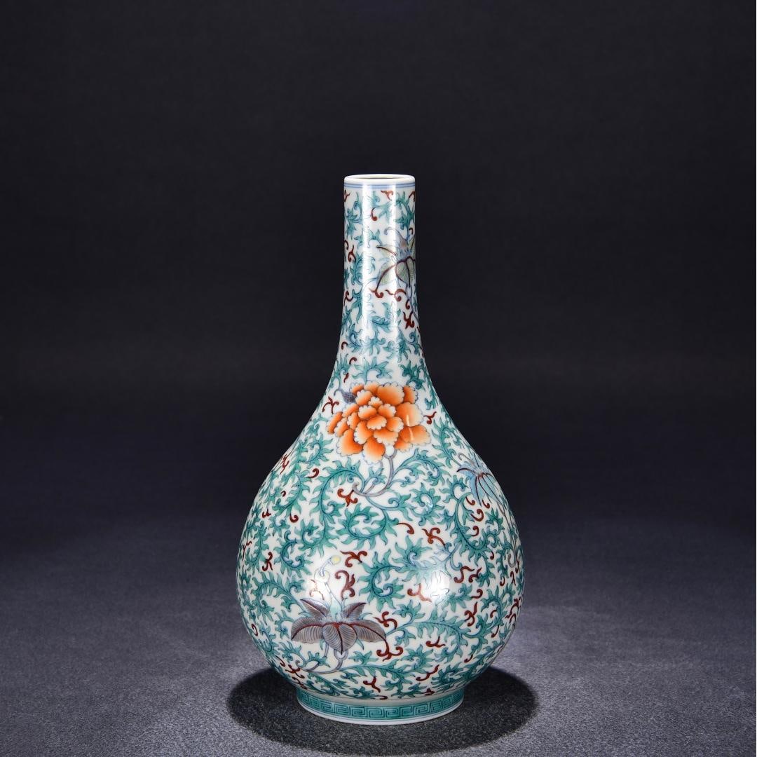 A Qing Dynasty Qianlong year Doucai entwined flower pattern gall bottle: Qing Dynasty Qianlong year Doucai entwined flower pattern gall bottle Size:H:27cm W:14cm (The Dimensions Of All Batches Are Manually Measured.If You Need More Detailed Information,