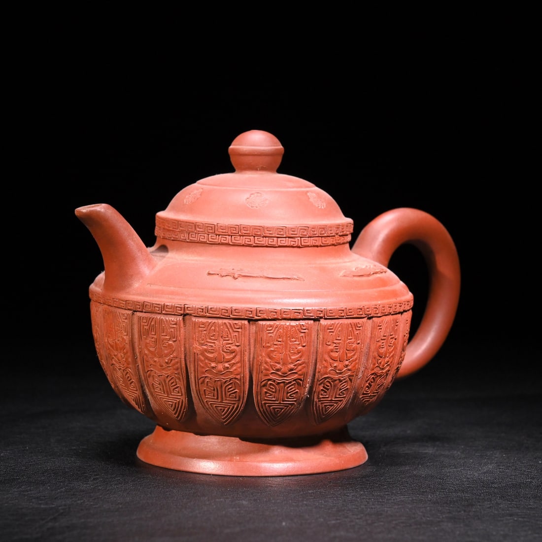 A Qing Dynasty tribute bureau purple sand carved animal face pattern teapot: Qing Dynasty tribute bureau purple sand carved animal face pattern teapot Size:H:11cmW:15.3cm (The Dimensions Of All Batches Are Manually Measured.If You Need More Detailed
