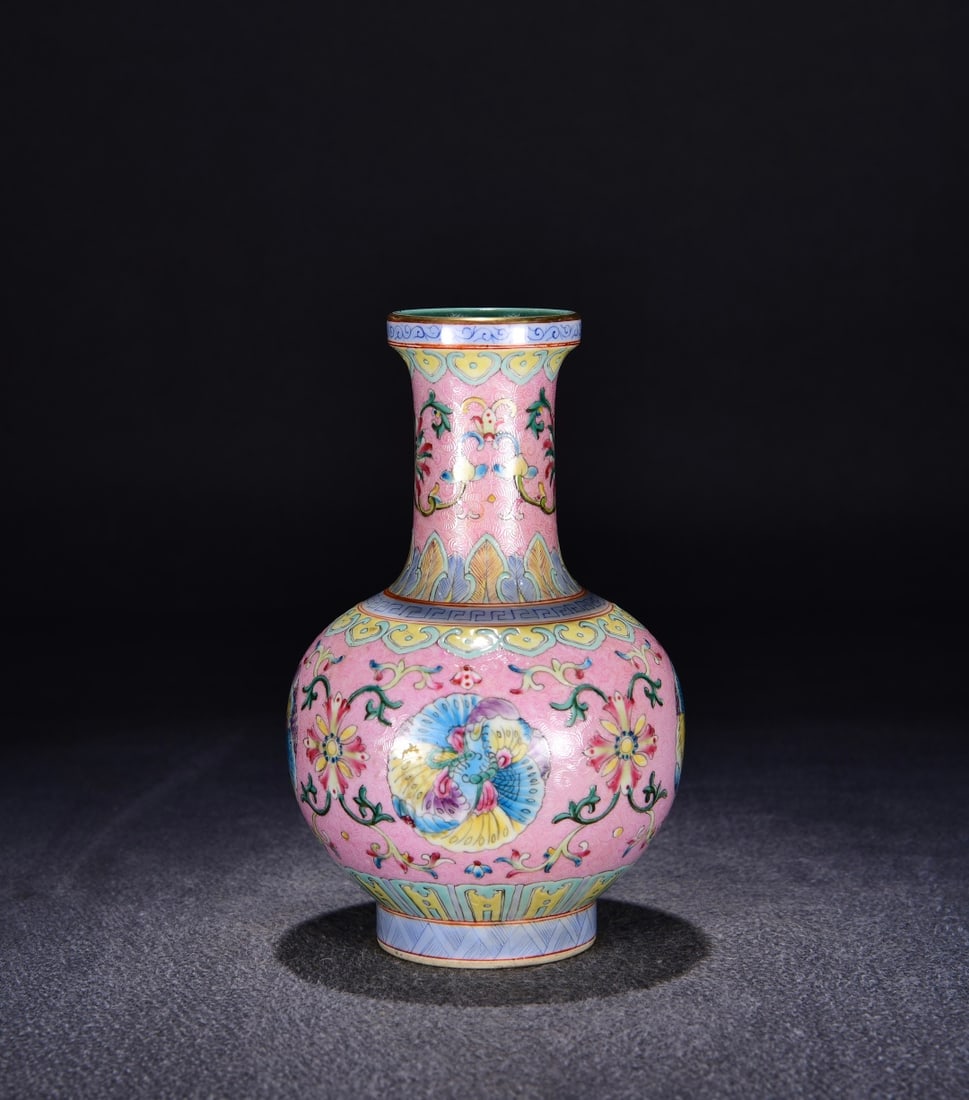 A red ground rolled enamel colorful butterfly picture bottle made in the Qianlong period of the Qing: Qing Dynasty Qianlong year red ground rolled road pattern enamel colorful butterfly picture bottle Size:H:21cmW:12cm (The Dimensions Of All Batches Are Manually Measured.If You Need