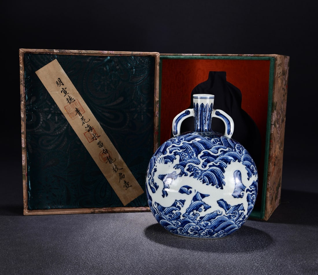 A blue and white seawater white dragon made in the Xuande era of the Ming Dynasty: The blue and white sea water of the Ming Dynasty Xuande year left a white dragon Size:H:27cm W:22cm (The Dimensions Of All Batches Are Manually Measured.If You Need More Detailed