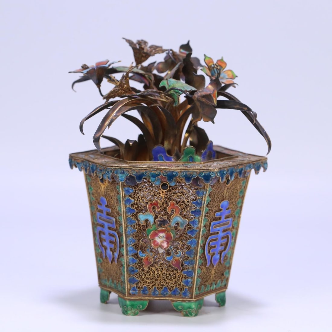 A silver-gilt filigree burnt blue orchid bonsai ornament from the Qing Dynasty: Qing Dynasty silver gilt filigree burnt blue orchid bonsai ornament Size: W:0.496kg16.7cmx12cmx14cm (The Dimensions Of All Batches Are Manually Measured.If You Need More Detailed