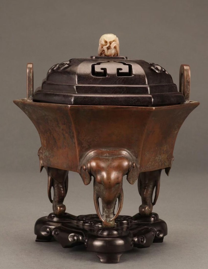 A beautiful bronze elephant head soaring into the sky (1 of 9)