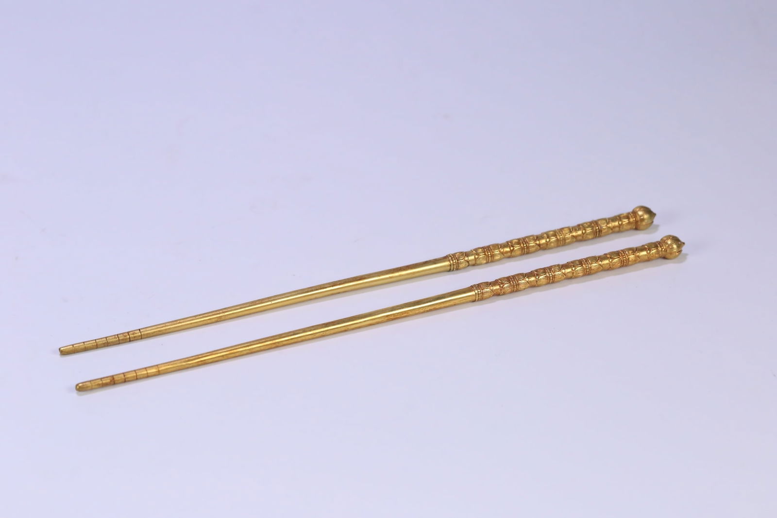 A pair of exquisite copper gilt lotus chopsticks: Exquisite copper gilt lotus chopsticks Size: W:0.094kg24.5cmx1cm (The Dimensions Of All Batches Are Manually Measured.If You Need More Detailed Information, Please Contact Our Customer Service Before