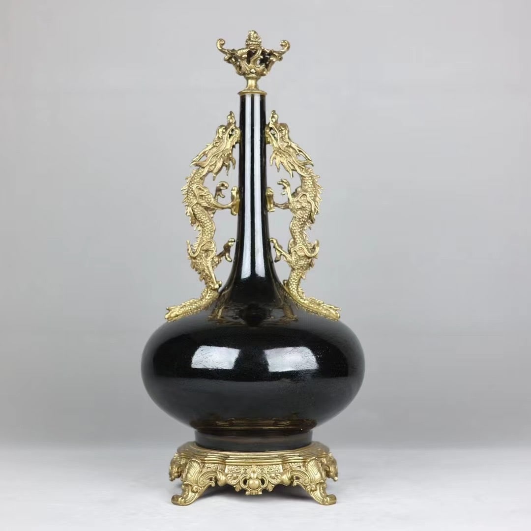 A fine copper-inlaid porcelain black gold glazed copper dragon gall bottle: Exquisite copper-inlaid porcelain black gold glaze inlaid copper dragon gall bottle Size:H:48cmCalibre:3cmBellydiameter:21cmBottom:17.5cm (The Dimensions Of All Batches Are Manually