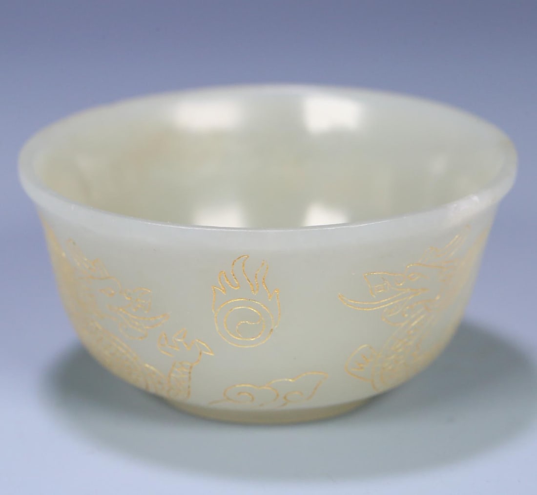 A small bowl of Hetian jade painted with gold double dragons in the Qing Dynasty: Qing Dynasty Hetian jade gold-painted double dragon bead small bowl Size:8.3x4.2cm W:0.1076kg (The Dimensions Of All Batches Are Manually Measured.If You Need More Detailed
