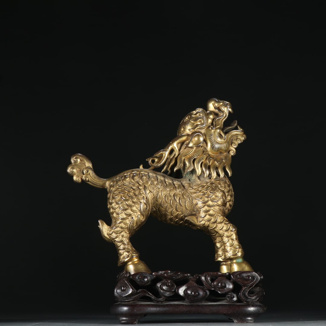 A copper-gilt unicorn ornament from the Qing Dynasty: Qing Dynasty copper gilt unicorn ornament Size:0.7879kgH:14.8cmW:14.2cm (The Dimensions Of All Batches Are Manually Measured.If You Need More Detailed Information, Please Contact