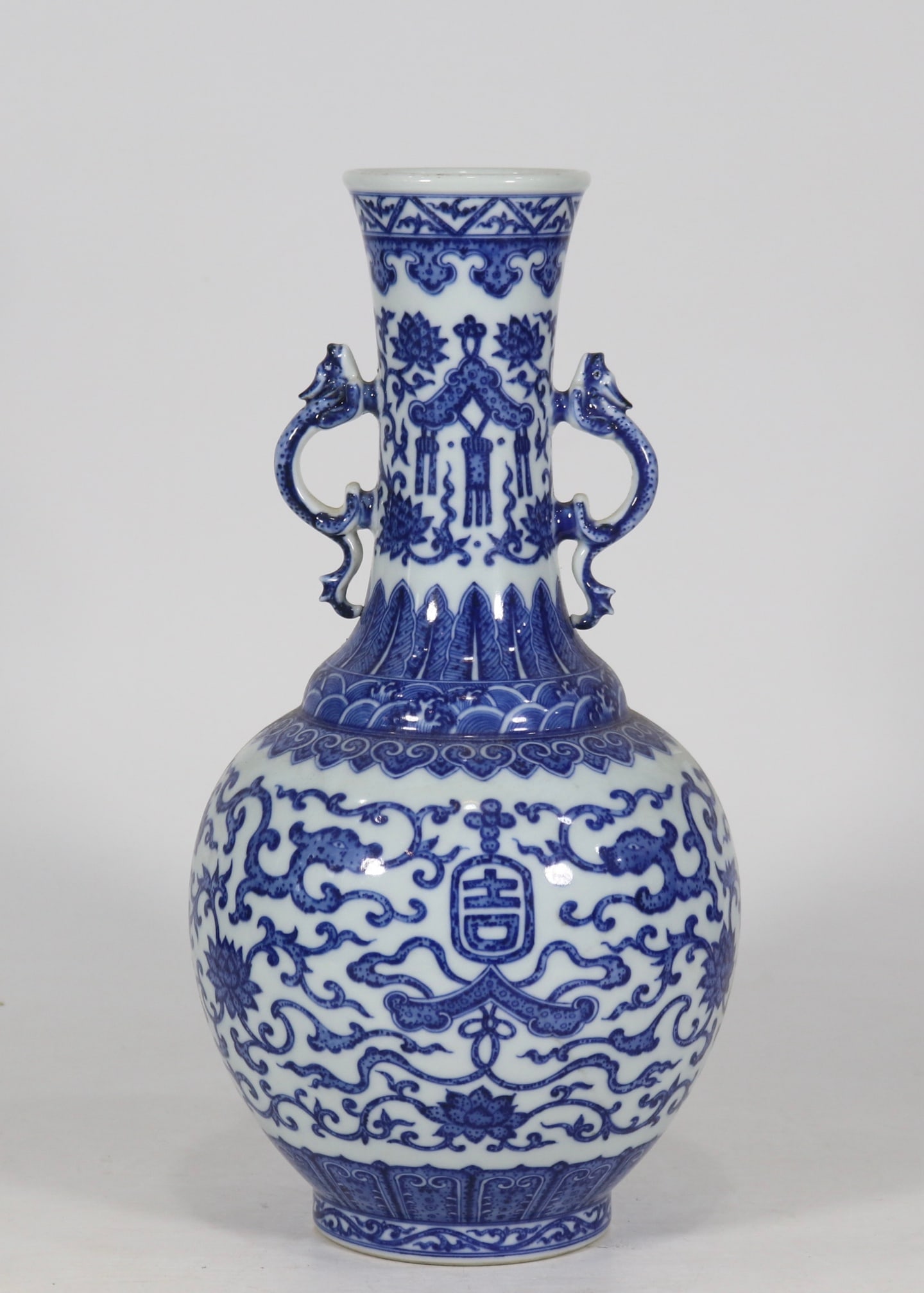 An Exquisite Blue and White Lotus Pattern Chi-Dragon Pattern Double-Ears Vase: An Exquisite Blue and White Lotus Pattern Chi-Dragon Pattern Double-Ears Vase Qing Dynasty, China Qianlong Six-character Mark Size:33.8cmx17cm (The Dimensions Of All Batches Are Manually